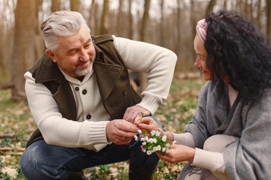 Elderly individuals participating in a supportive group session, adapting emotionally to life changes after retirement with guidance from an NGO in India.