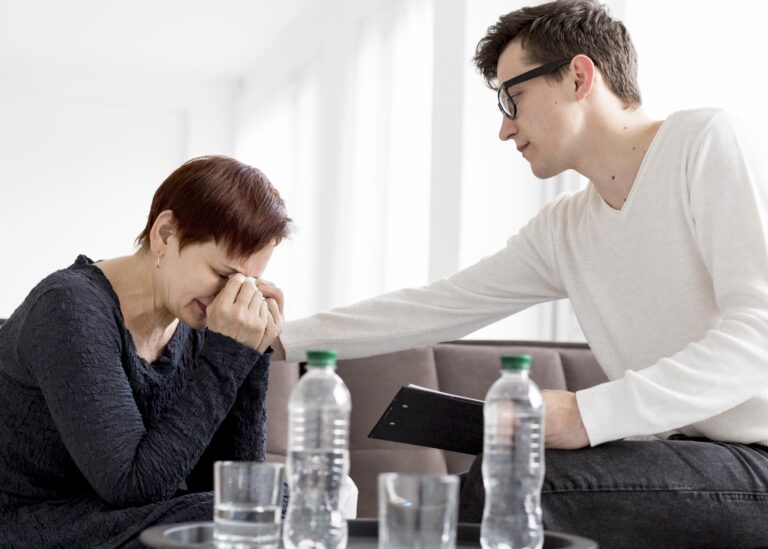 Person grieving the loss of a partner while coping with feelings of guilt and emotional distress after bereavement.