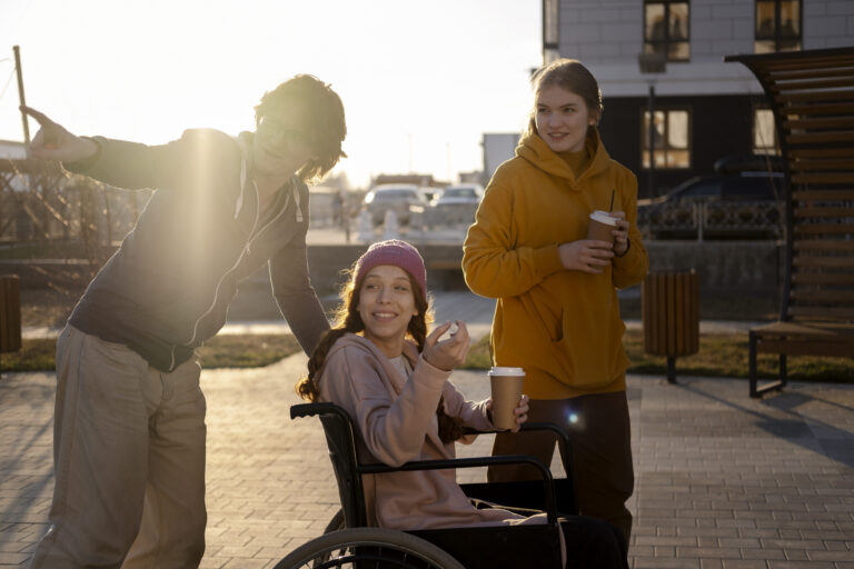 NGO volunteer supporting children with disabilities during a learning activity while parents receive guidance and emotional support.