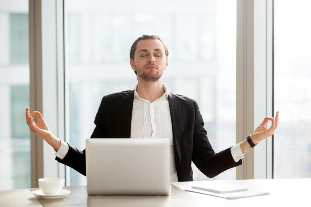 A person practicing mindfulness meditation in a calm environment to reduce stress, improve focus, and support emotional wellbeing.