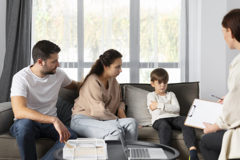 Child talking with a caring counsellor during a counselling session to improve emotional well-being and healthy coping skills.