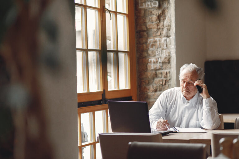 An elderly person relaxing at home while practicing stress management to prevent burnout and improve emotional well-being.