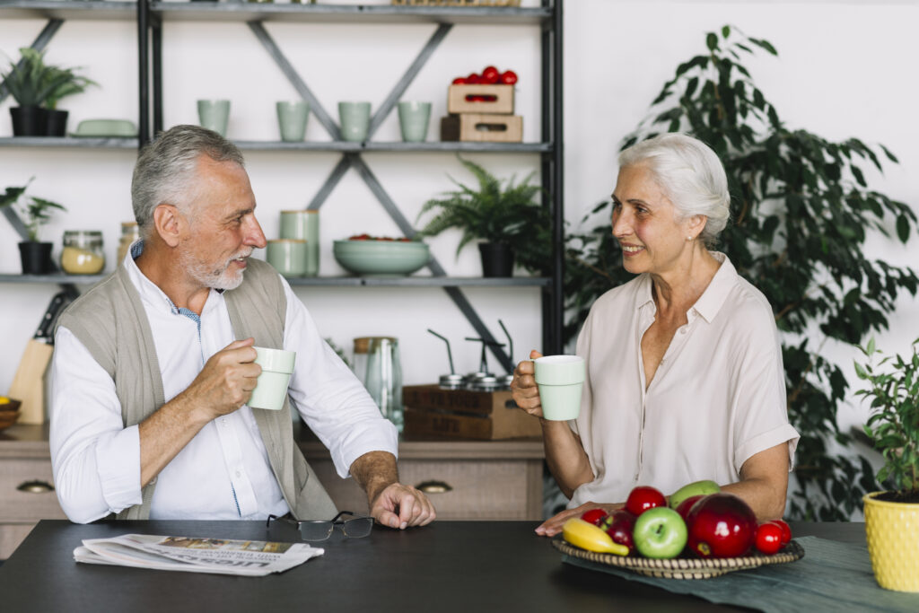 Retired couple enjoying a heartfelt conversation, strengthening emotional bonds and overcoming relationship challenges after retirement.